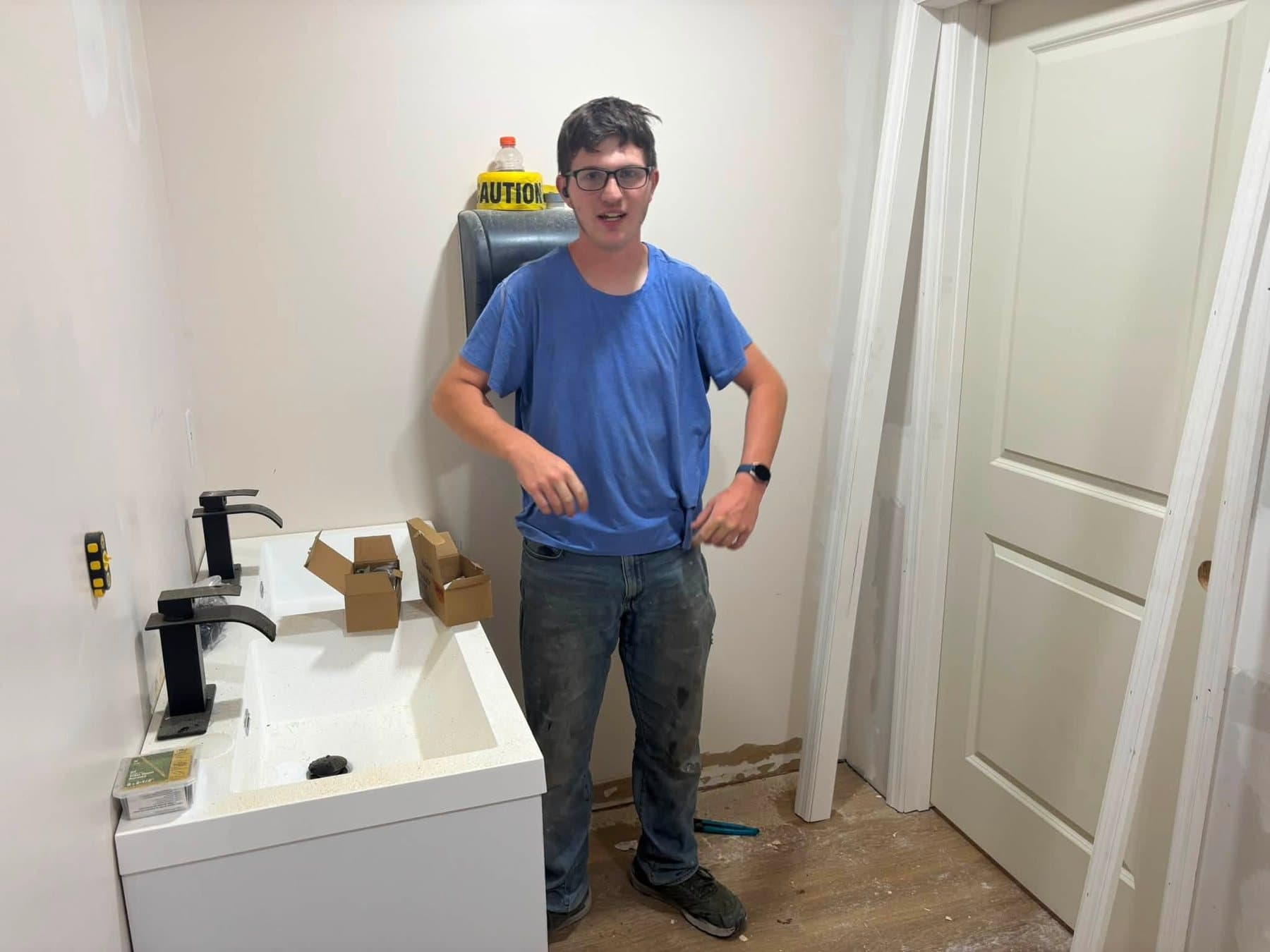 A freshly rebuilt restroom with new flooring and fixtures