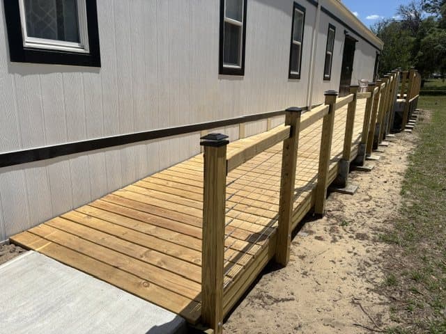 The new ramp, fresh lumber and a new rail along the side of the building