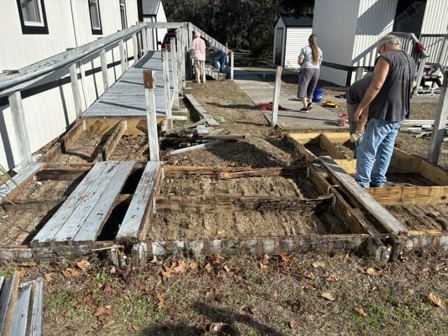 The old wooden ramp torn out down to the posts