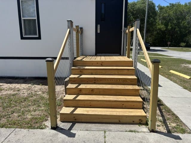 New wooden steps and rail at the side door