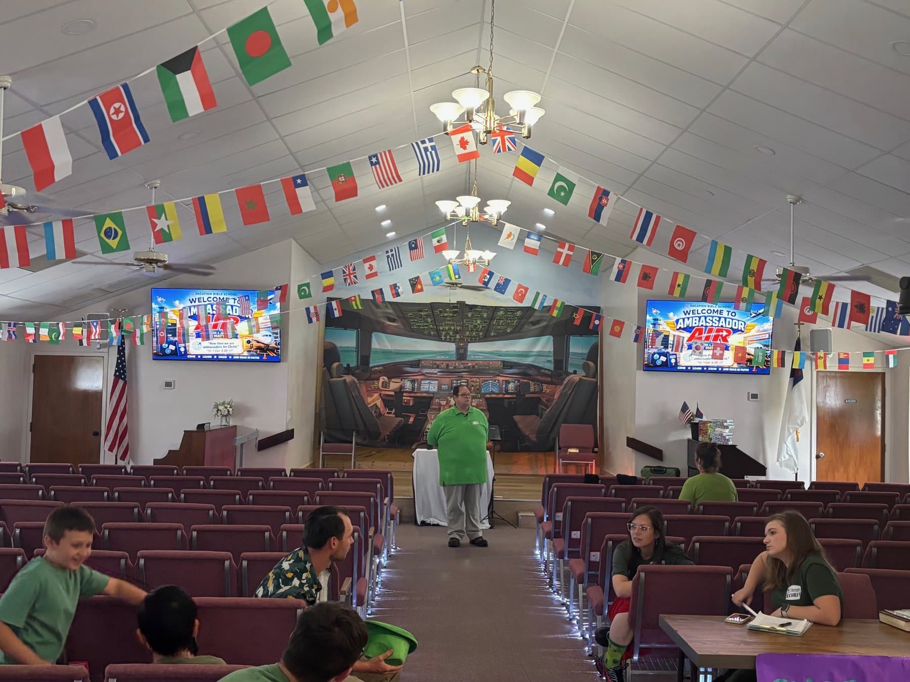 The sanctuary strung with flags of the nations for Vacation Bible School