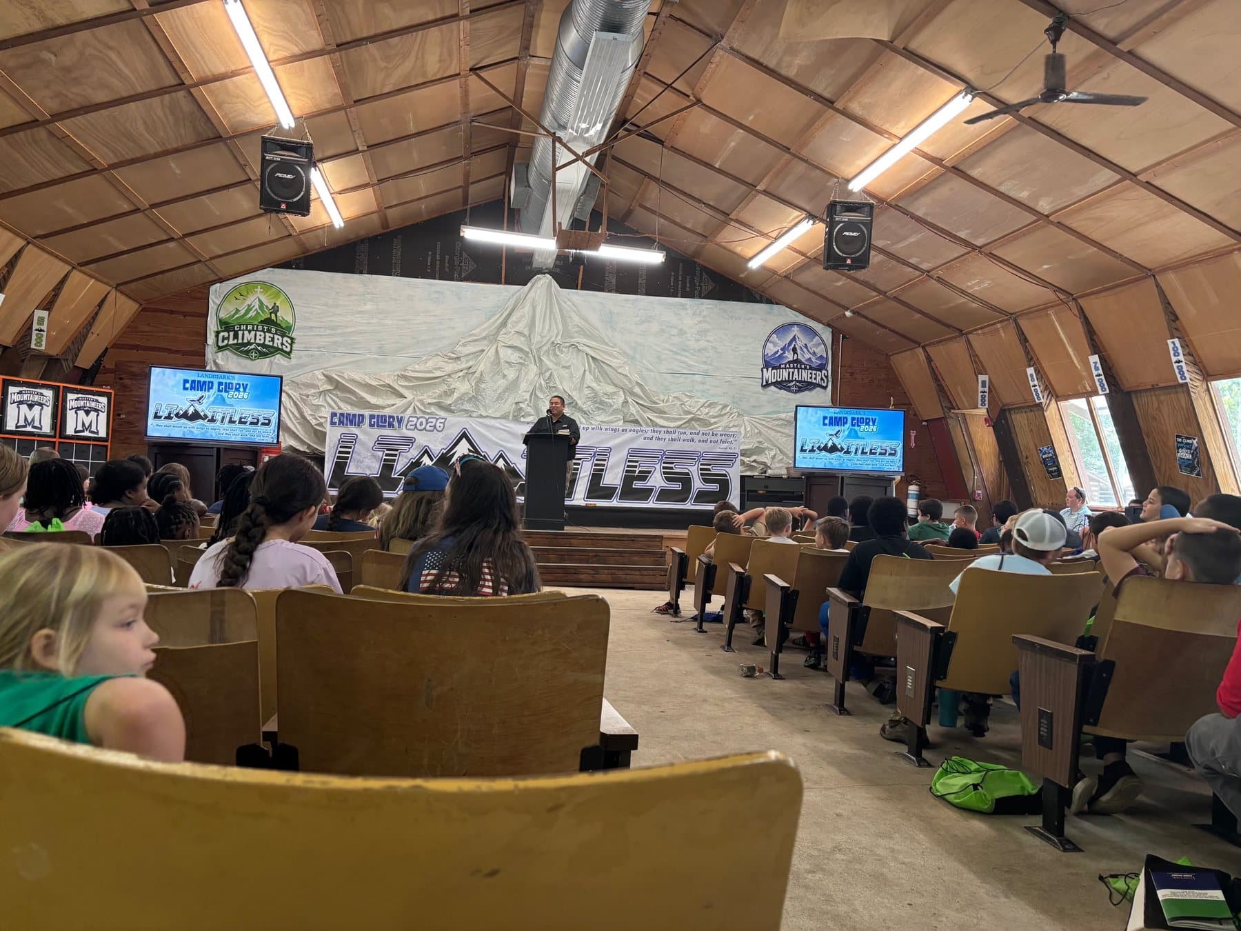 A tabernacle full of young people at a youth conference